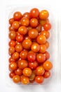 Cherry tomato in plastic container package, studio shoot on whit Royalty Free Stock Photo
