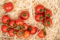 Cherry tomato on straw mat Royalty Free Stock Photo