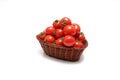 Cherry tomatoes in a basket isolated on a white background Royalty Free Stock Photo