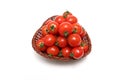 Cherry tomatoes in a basket isolated on a white background Royalty Free Stock Photo