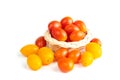 Cherry Tomatoes in a basket. Solanum lycopersicum L. var. cerasiforme. isolated on white background and clipping path Royalty Free Stock Photo