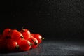 Cherry tomatoes on a black background in the spray Royalty Free Stock Photo