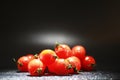 Cherry tomatoes on a black background in the spray Royalty Free Stock Photo