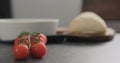 Cherry tomatoes branch on conrete countertop Royalty Free Stock Photo