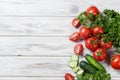 Cherry tomatoes on a branch, cucumber, parsley Royalty Free Stock Photo