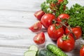 Cherry tomatoes on a branch, cucumber, parsley Royalty Free Stock Photo