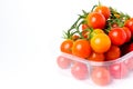 Cherry tomatoes on a branch in transparent retail plastic box Royalty Free Stock Photo