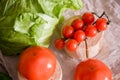 Cherry tomatoes, cabbage on a deervian background. preparation of salad. Summer concept of proper healthy eating. Royalty Free Stock Photo