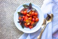 Cherry tomatoes in ceramic plate r on concrete background. Space for text selective focus. Royalty Free Stock Photo