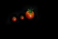 Cherry tomatoes closeup isolated on black background Royalty Free Stock Photo