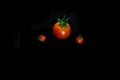 Cherry tomatoes closeup isolated on black background Royalty Free Stock Photo