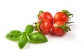 Cherry Tomatoes with green fresh basil leaf isolated on white background Royalty Free Stock Photo