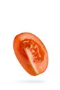 Cherry tomatoes isolate on white. a quarter of a tomato close-up, casts a shadow. Royalty Free Stock Photo