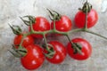 Cherry tomatoes isolated over grey background Royalty Free Stock Photo