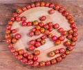 Top view of cherry tomatoes on the wooden serving board Royalty Free Stock Photo