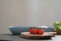 Cherry tomatoes on olive wood board Royalty Free Stock Photo