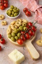 Cherry tomatoes, olives and tarallini on wooden board