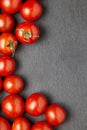 Cherry tomatoes over stone table. Royalty Free Stock Photo