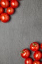 Cherry tomatoes over stone table. Royalty Free Stock Photo