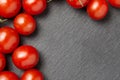 Cherry tomatoes over stone table. Royalty Free Stock Photo