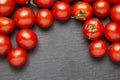 Cherry tomatoes over stone table. Royalty Free Stock Photo