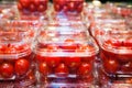 Cherry tomatoes packed in plastic containers Royalty Free Stock Photo