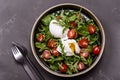 Cherry Tomatoes, poached eggs and herbs mix salad Royalty Free Stock Photo