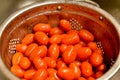 Cherry tomatoes rinsed in a strainer