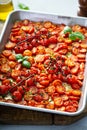 Cherry tomatoes roasted with garlic and spices on a tray Royalty Free Stock Photo