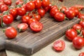 Cherry tomatoes are scattered on a wooden table Royalty Free Stock Photo