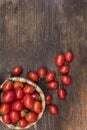 Cherry tomatoes ,is a small tomatos on wood top and Basket weave