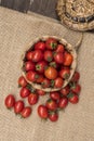 Cherry tomatoes ,is a small tomatos on wood top and Basket weave