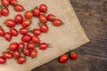 Cherry tomatoes ,is a small tomatos on wood top ,have beta-carotene vitamin C and vitamin E