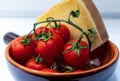 Cherry tomatoes with stem and cheese close up Royalty Free Stock Photo