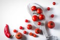 Cherry tomatoes, tomatoes on a branch, pepper, stand on a white
