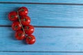Cherry tomatoes on wooden table Royalty Free Stock Photo