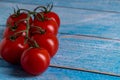 Cherry tomatoes on wooden table Royalty Free Stock Photo
