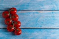 Cherry tomatoes on wooden table Royalty Free Stock Photo