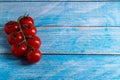 Cherry tomatoes on wooden table Royalty Free Stock Photo