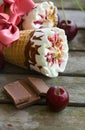 Cherry vanilla ice-cream with caramel topping. Closeup Royalty Free Stock Photo