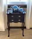 Cherry Wood TeaBags Cabinet with Blue and White Willow Design Tea Set on top