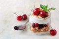 Cherry yogurt parfait in a mason jar on marble Royalty Free Stock Photo