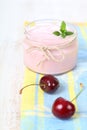 Cherry yogurt and ripe cherry Royalty Free Stock Photo