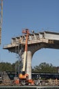 Cherrypicker being used in Construction of a bridge. USA