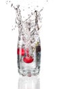 Cherrys splashing into a glass Royalty Free Stock Photo