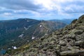 Chersky peak, stones, rocks on mountain ridge, view of mountain lake in form of heart among snow ice glaciers, mountain range Royalty Free Stock Photo