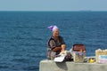 A local woman selling pies to tourists in Chersonesus Royalty Free Stock Photo