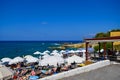 Chersonissos, Greece - June 27, 2015: Many people enjoy a summer day at the Beach Royalty Free Stock Photo