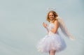 Cherub angel pray. The God of Love. Portrait of little curly blond Angel girl. Love card. Angel child girl with curly Royalty Free Stock Photo