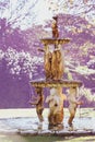 Cherubs water fountain in park on sunny day